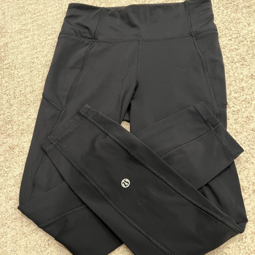 Black Lululemon leggings with back zipper pocket -size 4